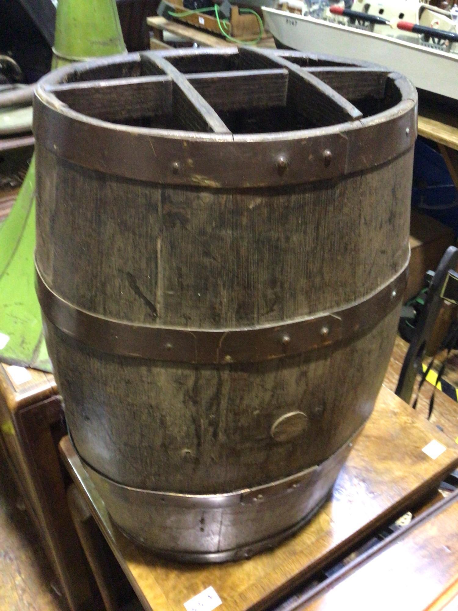 An oak and metal bound coopered barrel converted to a stick or umbrella stand, with compartmented