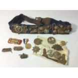 A collection of WW1 cap badges and shoulder badges etc, including 1st Tank Battalion Canada, mounted