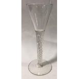An 18th century cordial glass with conical bowl and multi-twist clear glass stem, ground pontil