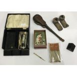 Various propelling pencils and nibs including a gold propelling pencil shaped as an arm with hand,