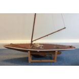 A large 1930s handmade pond yacht with planked and pinned wooden hull, lined plywood deck, ash