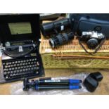 An Olympus OM30 camera, Tamron zoom macro lens 85-210mm, smaller Tamron lens and a tripod,