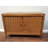 A 1950's Gordon Russell Double Helix rosewood sideboard designed by David Booth and Judith Ledeboer,