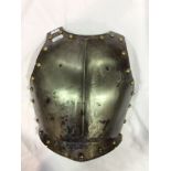 A 17th century English Civil War period breast plate, with central raised ridge drawn out to a