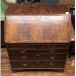 A mid 18th century and later walnut bureau, with sloped front enclosing a well with sliding cover,