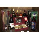 A small collection of assorted spirits comprising 1 litre bottles of Captain Morgan spiced and