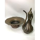 A large Persian copper and brass ewer with half reeded body, together with a similar copper bowl