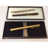 A Dunhill fountain pen with engine turned case, 14k gold nib marked '585', with Dunhill box,