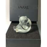 A Lalique crystal figure of a seated Panda, with label to back, signed to base, No. 1205200, in