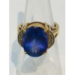 An 18ct yellow gold dress ring, set with a large oval Tanzanite, measuring 12x8mm. Ring weighs 8.