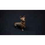 A bronze figure of a seated Corgi, 10cm long