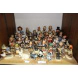 SECTION 29. Over 40 Goebel Hummel figures mainly of children, three cats and a dog with fly on his