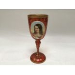 A 19th century Bohemian cranberry glass goblet, decorated with a hand-painted oval portrait of a