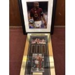 A photograph of Thierry Henry in Arsenal kit, baring autograph, mounted, glazed and framed, with