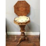 A Victorian walnut ladies sewing work table, of octagonal form, hinged burr-wood top enclosing