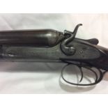 A Holland & Holland 12-bore hammer action shotgun, with 28" inch side-by-side Damascus barrels,