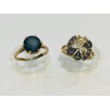 Two 9ct yellow gold dress rings, the solitaire ring is set with a round blue stone, weighing 3.0