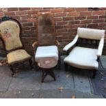 A Victorian nursing chair with floral tapestry upholstery, together with a low armchair, a carver