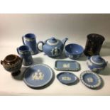 A Wedgwood Jasperware coronation teapot, 1953, together with two milk jugs, sugar bowl and pin