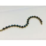 A 9ct gold tennis bracelet, set with 21 x round black diamonds in a claw setting, weighs 19.0 grams.