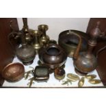 SECTION 12. Various engraved brass and copperwares including Islamic style pots, ewers, vases,