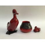 A Royal Doulton Flambe pottery model of a duck, 16cm high, together with a Doulton Flambe duckling