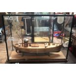A nice quality handmade wooden model fishing trawler, with planked and pinned hull and deck, two