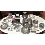 A large quantity of silver-plated items including trays, teapot, coffee cups, ice bucket, glass