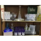 Two shelves of cut glass including a cut glass decanter of tapering hexagonal form, Waterford