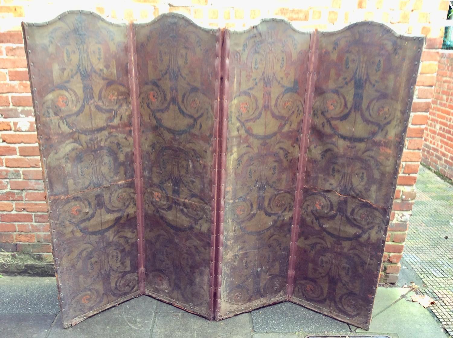 A Victorian four-fold dressing screen covered with arabesque-embossed leather, (AF) 216x192cm,