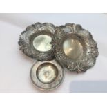 A pair of silver pierced and embossed circular bon-bon dishes by the Goldsmiths and Silversmiths