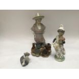 Three assorted Lladro ceramic figures comprising a Mexican ceramic street vendor, a girl holding a