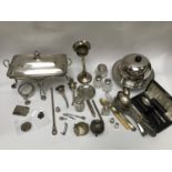 A mixed lot of silver and silver-plated items including silver-topped toilet jars, a pair of