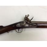 A late 18th/ early 19th century flintlock carbine, with 23" inch steel barrel, lock engraved with