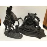 A Victorian wood and composition black painted wall bracket with ornately scrolled under-tier,