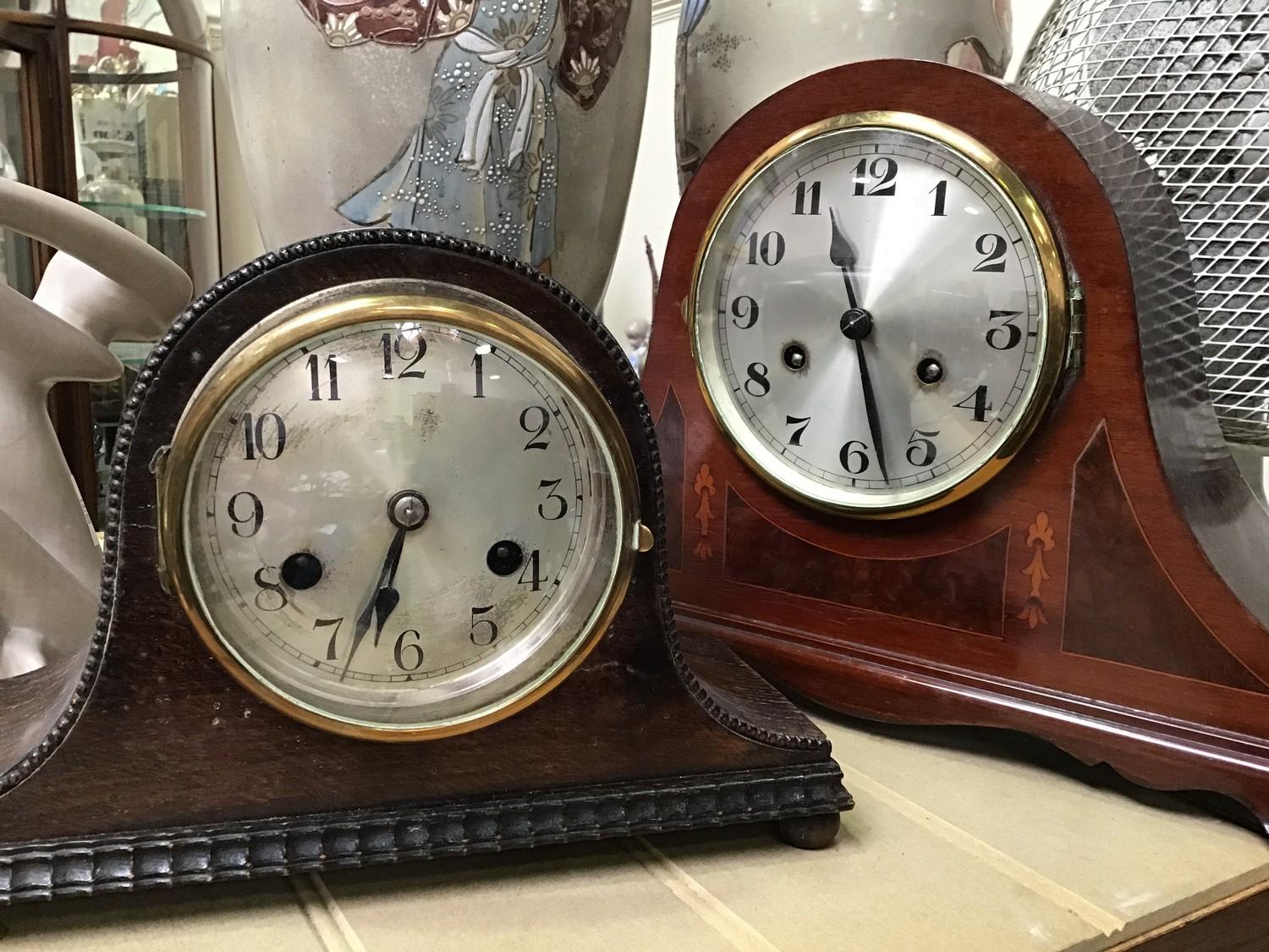 An early 20th century inlaid 'cocked hat' mantel clock, together with a smaller similar clock by
