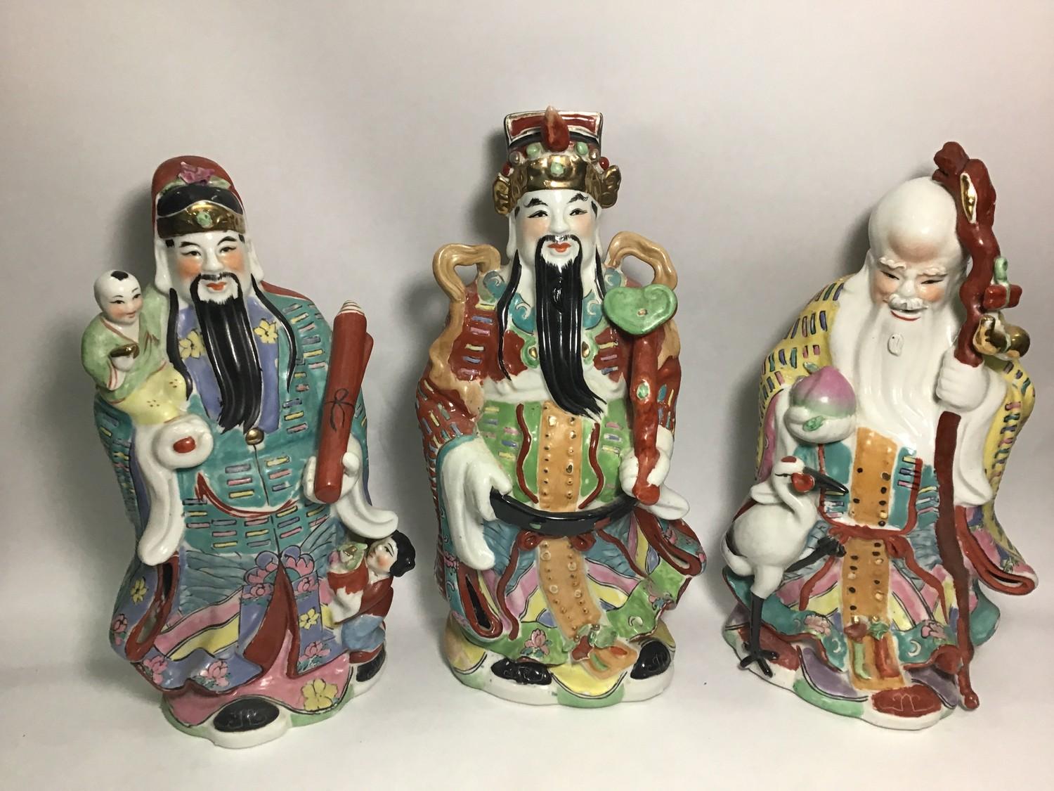 Three large porcelain figures of The Sanxing Chinese Immortals of the three stars or constellations,