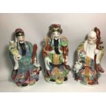 Three large porcelain figures of The Sanxing Chinese Immortals of the three stars or constellations,