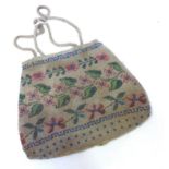 An antique ladies evening bag, possibly made by a French POW, and worked with beads depicting a