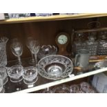 A small collection of assorted glassware comprising an oak tantalus with three bottles and one