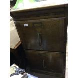A 1920s two-drawer oak filing cabinet