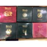 Six unopened commemorative Bell's Extra Special, 8 year aged, Old Scotch Whisky Christmas decanters,