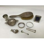 A small collection of assorted silver items comprising a silver caddy spoon in the form of a right