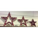 A graduated set of three electric illuminating metal stars, measuring: 130cm, 98cm and 75cm high