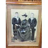 An early 20th century 'China Trade' portrait of a lady wearing Victorian style dress and hat, seated