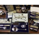 A collection of assorted silver-plated wares comprising cased sets of flatware, Walker and Hall fish