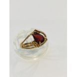 A 9ct yellow gold dress ring, set with a large opaque ruby in a four claw setting, ring weighs 5.8