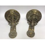 A pair of Renaissance 'style' brass cast wall brackets with pierced strapwork decoration and