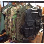 Eight various camoflage/flak jackets etc.