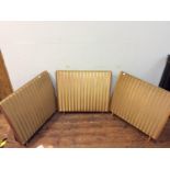Three Quad Electrostatic Loud Speakers, each with gilt metal grill fronts and wooden supports, 85